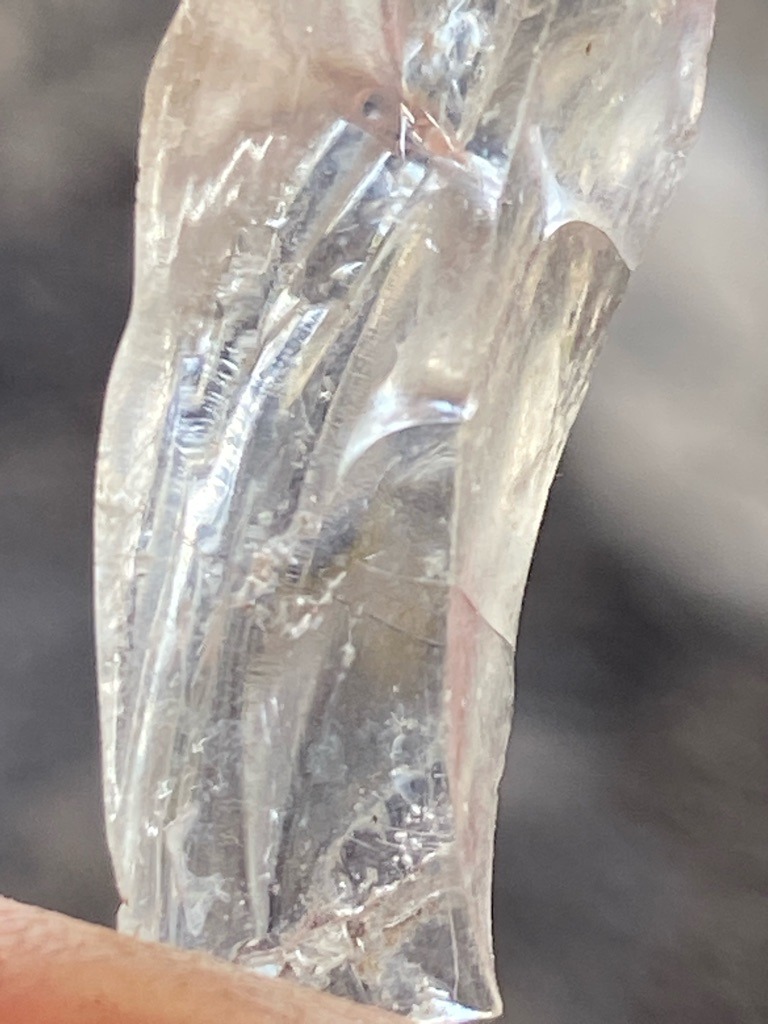 Natural rough crystal / mineral specimen, appearing to be quartz or similar silicate rather than a faceted gemstone diamond - Rough uncut crystal / raw mineral form