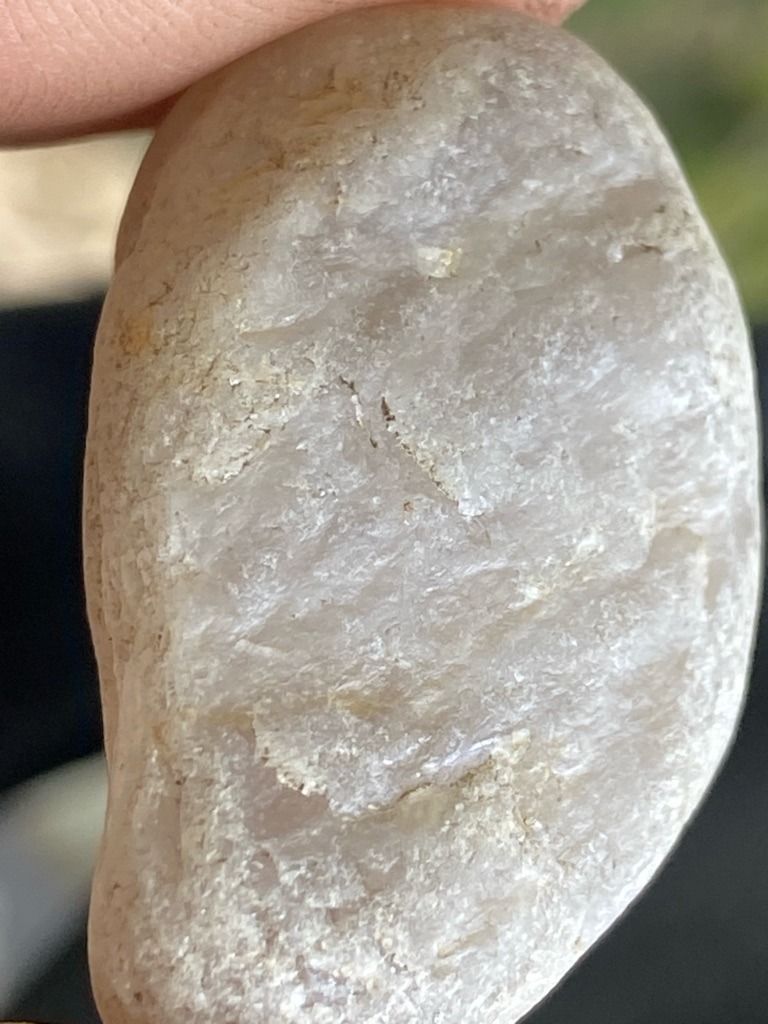 Not a diamond (appears to be a rough quartz pebble, chert, or quartzite) - Uncut, water-worn natural pebble shape (oval-ish rough)