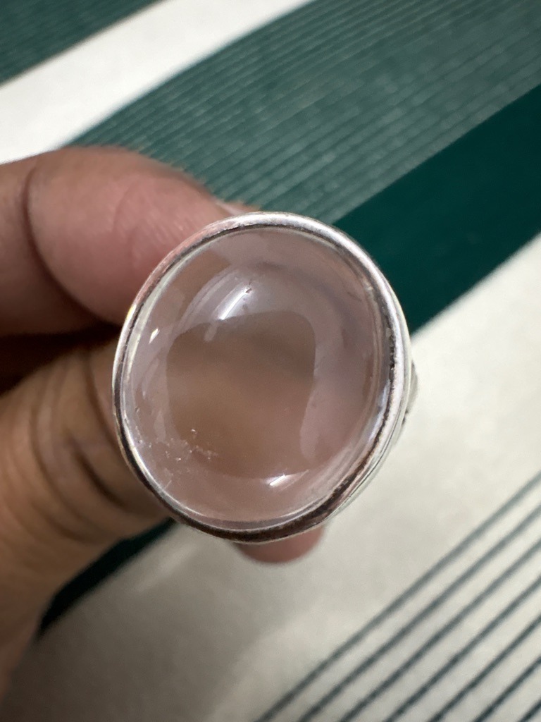 Not a diamond; this gemstone appears to be Rose Quartz (a variety of crystalline quartz). - Oval Cabochon
