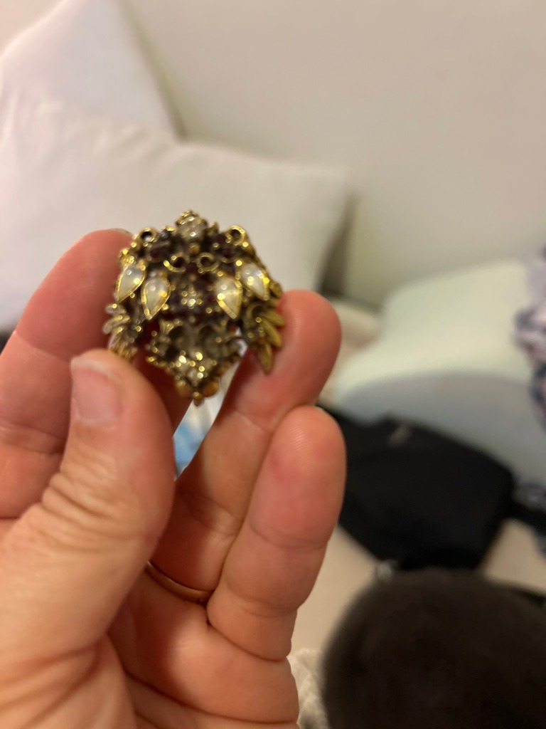 The central and accent stones appear to be a mix of small, likely rose-cut or old-mine cut vintage diamond melee alongside other ornamental gems (pearls or cabochons) set in an antique-style cluster mounting. - Irregular vintage cluster containing small mixed cuts (rose-cut or old mine cut style).