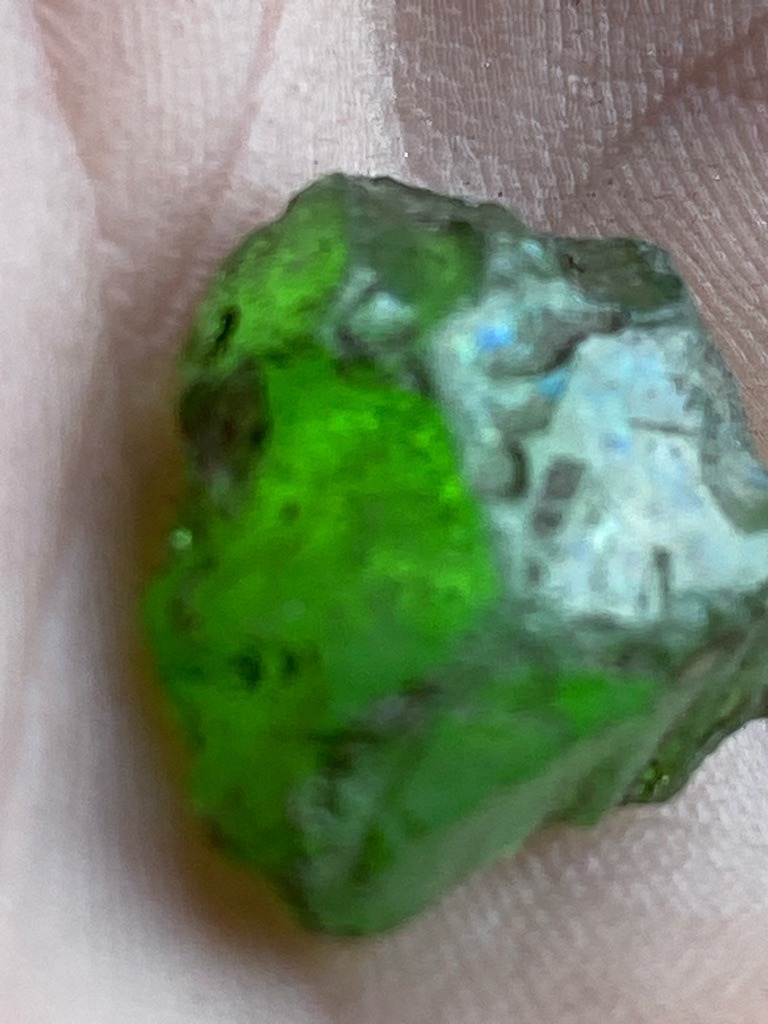The specimen shown in the image is not a diamond; it appears to be a raw, unpolished mineral crystal, likely green tourmaline, peridot, or a similar green gemstone matrix, as diamonds do not naturally occur in this rough, opaque green crystal habit with this texture. - Rough crystal / Natural unshaped form