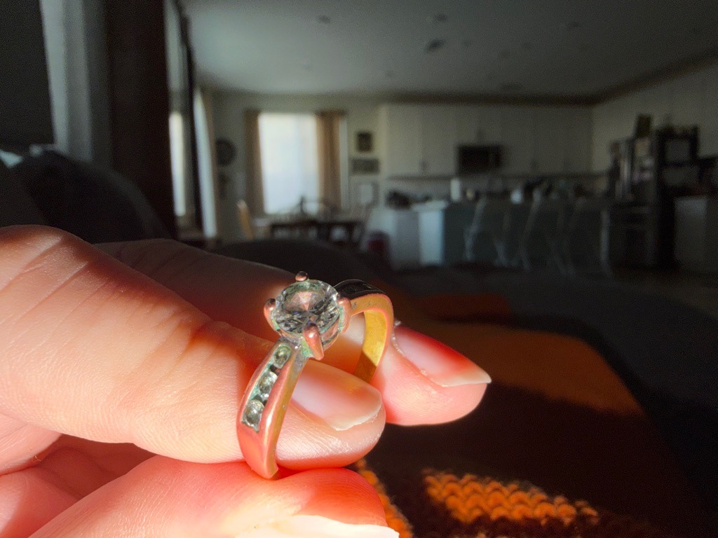 Natural Diamond (Assumed based on jewelry style) - Round Brilliant