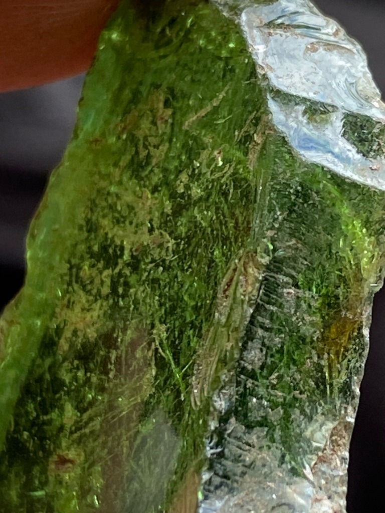 Not a diamond; this is a rough green glass or slag material exhibiting conchoidal fracture and internal flow lines. - Rough, unpolished raw fragment with irregular shape