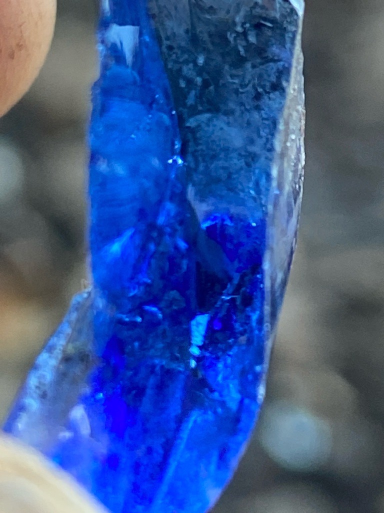 Not a diamond; this is a raw, unpolished, vibrant blue mineral specimen, likely synthetic glass or a low-grade corundum/spinel, but visually consistent with cobalt-doped glass or rough lapis/slag. - Uncut, raw, irregular rough crystal fragment with conchoidal fracture patterns.