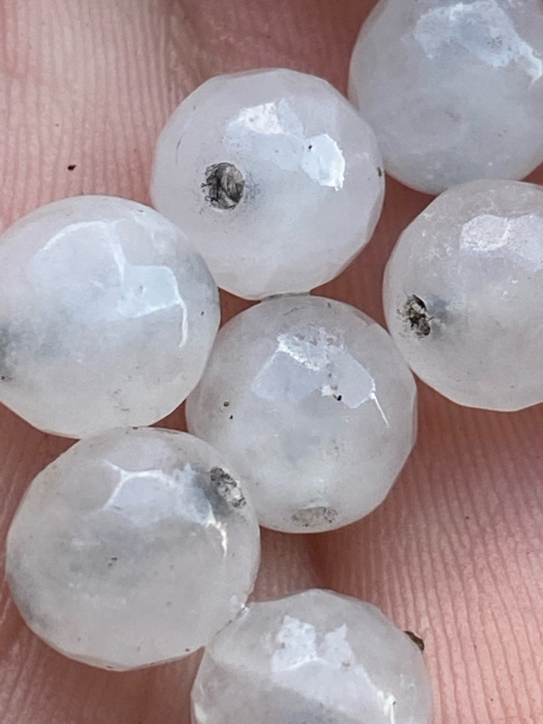 Not a diamond; these appear to be faceted natural mineral beads (such as quartz, chalcedony, or moonstone) rather than gem-grade diamond. - Faceted Round Bead