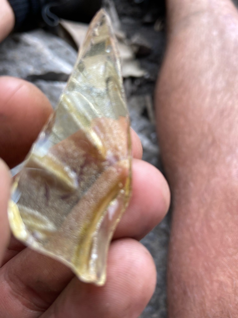 Not a diamond; appears to be raw glass or slag material - Irregular raw fragment