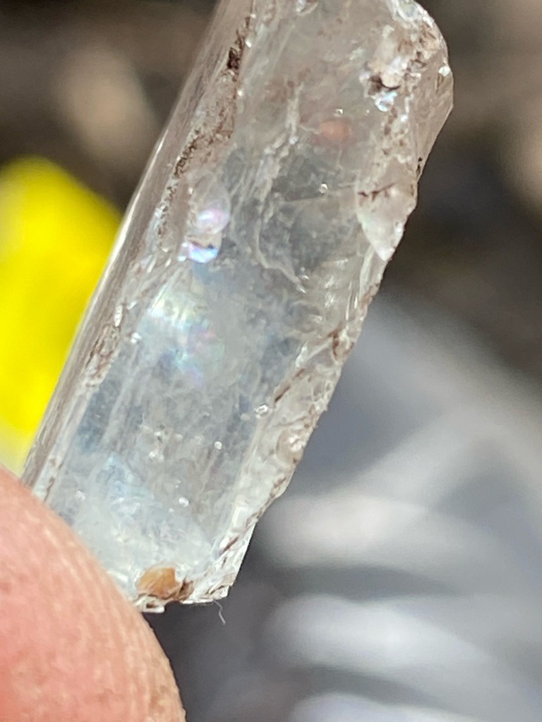 Natural rough mineral crystal (likely quartz, beryl, or topaz, not a diamond) - Uncut raw crystal (elongated prismatic crystal form)