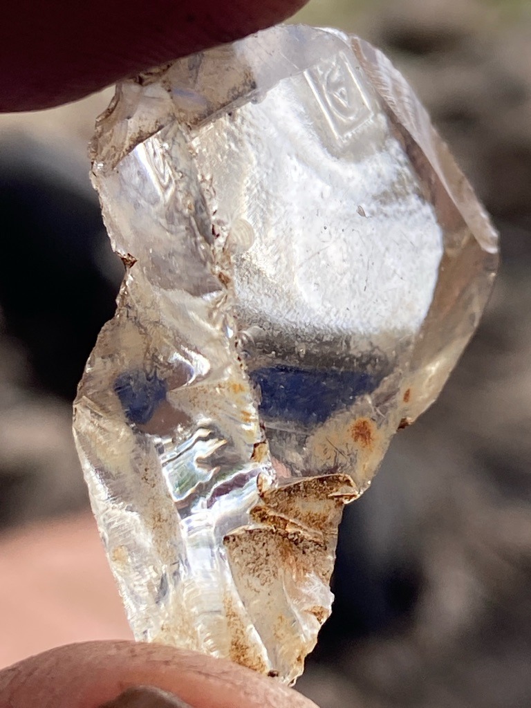 Natural rough crystal (likely quartz or industrial diamond rough, though visually shows features more consistent with raw mineral crystal specimen rather than gem-quality diamond) - Rough crystal / Irregular uncut form