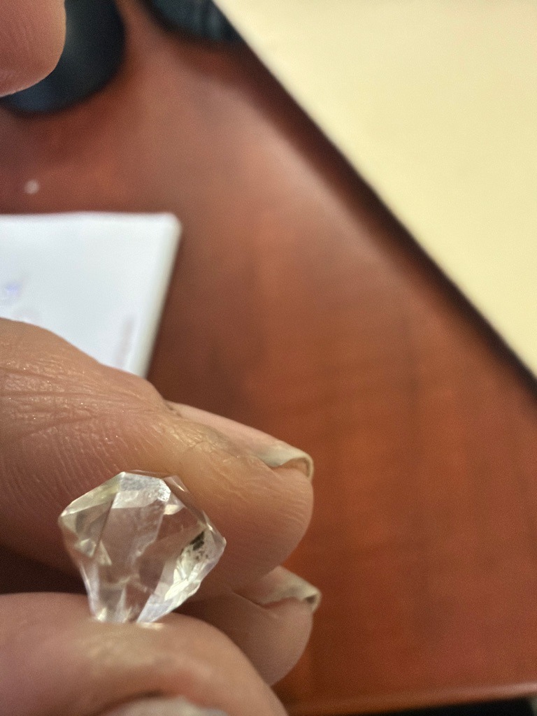 Natural rough diamond crystal, likely gem-quality octahedron form with natural crystal faces (octahedral crystal habit) - Uncut octahedral rough crystal showing natural geometric crystal faces and modified edges