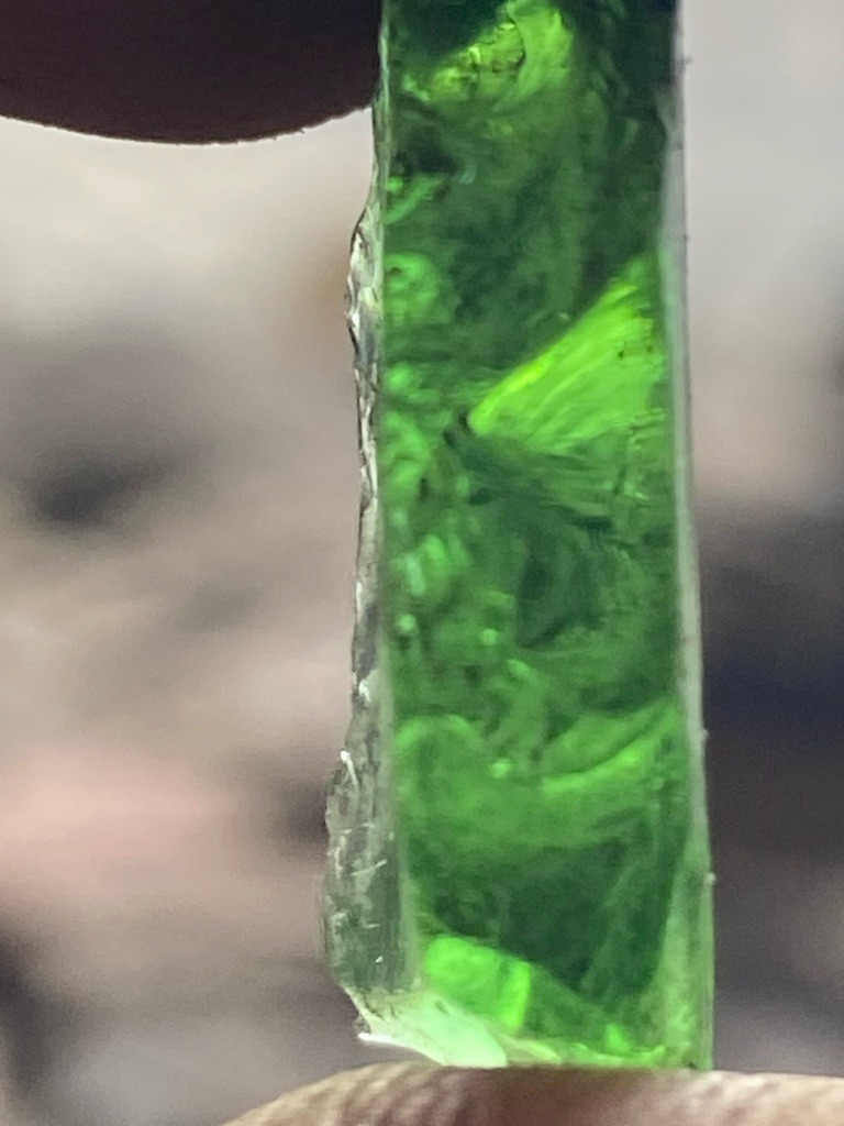 Not a diamond (Green glass or slag material) - Rough elongated bar or slab