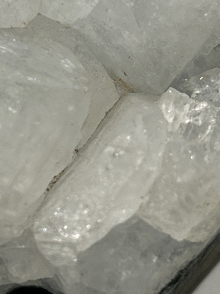 Not a diamond; this image shows raw, unpolished mineral cluster formations, likely quartz or calcite geode crystals rather than crystallized carbon. - Irregular raw crystal cluster / uncut mineral formation