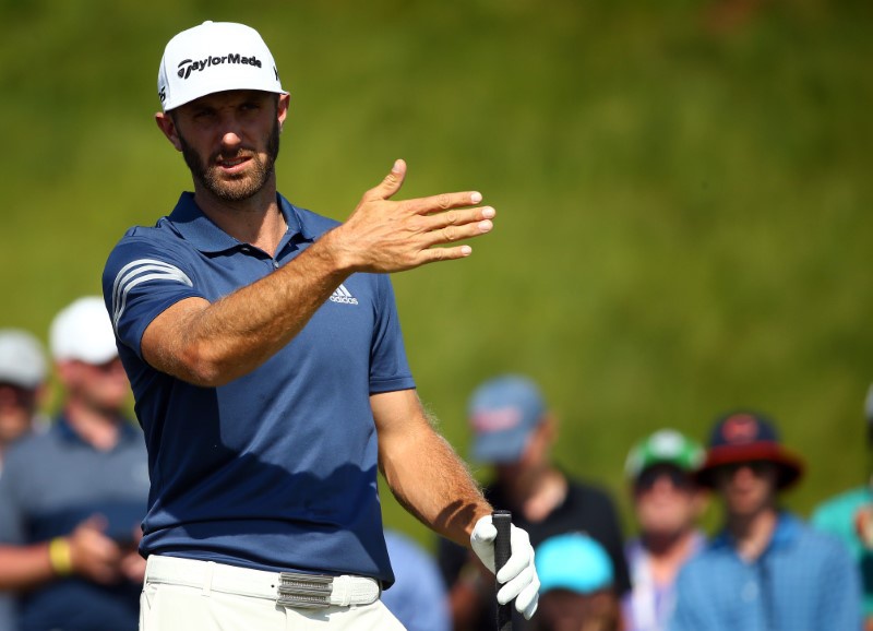 Proud papa Johnson poised to defend US Open title
