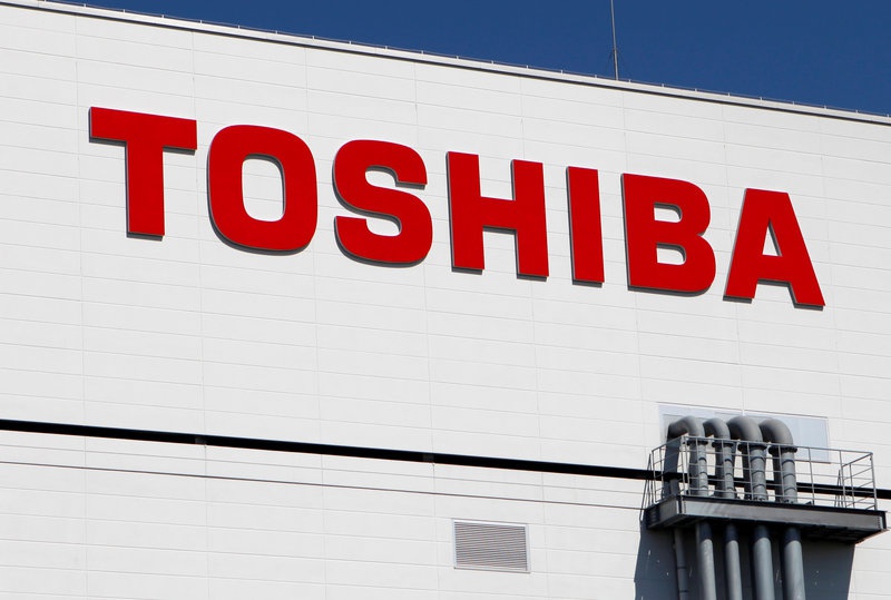 FILE PHOTO - The logo of Toshiba is pictured on its flash memory factory, seen during a media tour in Yokkaichi, western Japan September 9,