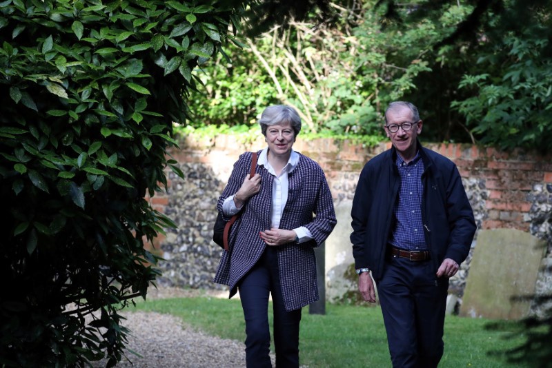 Britain's Prime Minister Theresa May and her husband Phillip arrive at a church in Sonning Britain