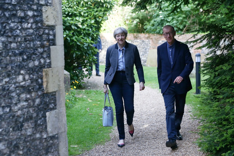 Britain's May apologises to own MPs for election 'mess'