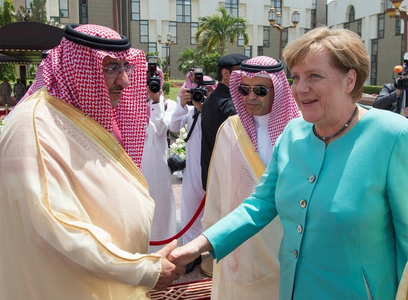 Saudi Crown Prince Mohammed Bin Nayef shakes hands with German Chancellor Angela Merkel during a reception ceremony in Jeddah Saudi Arabia