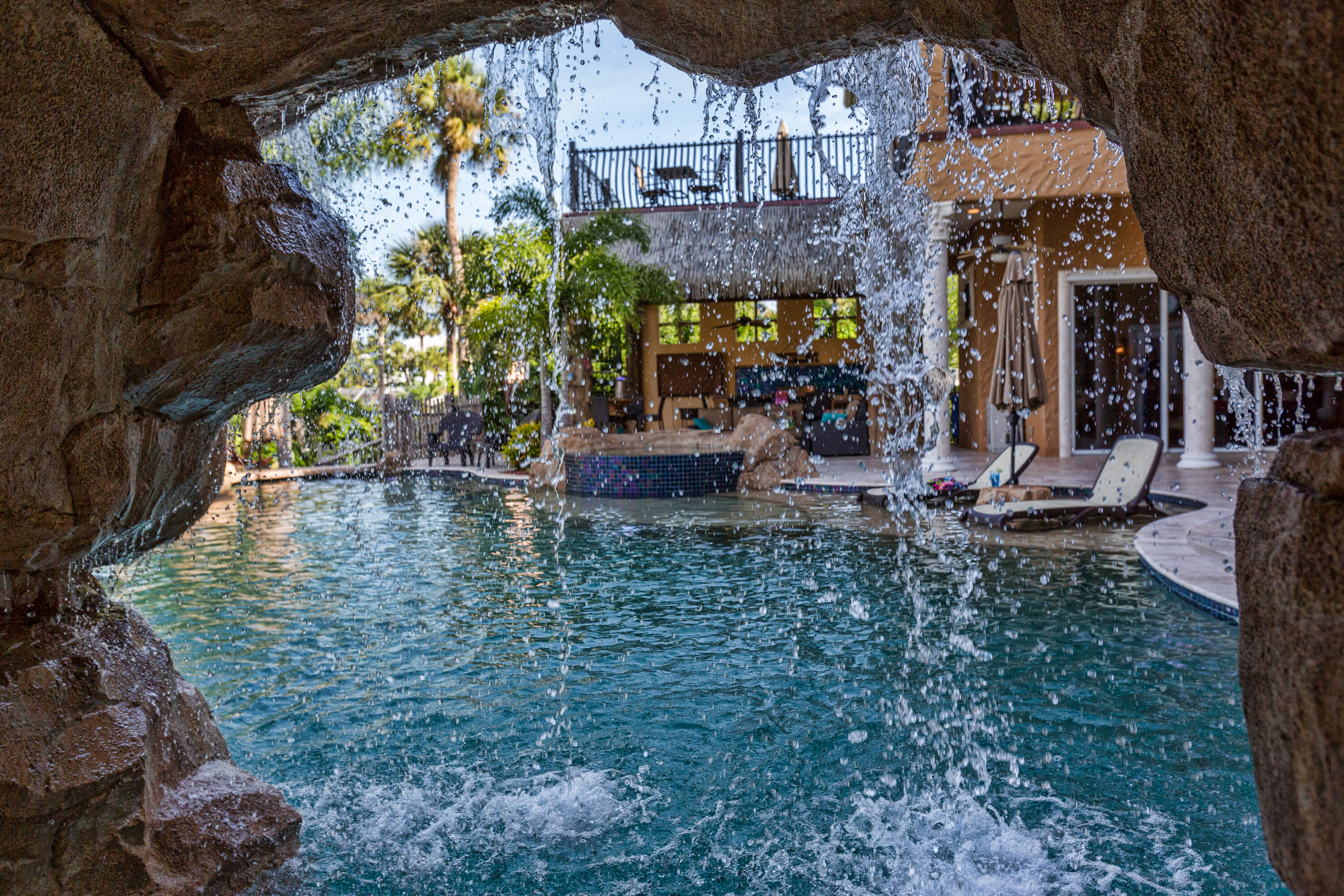 7b8b644f looking from a cave out towards swimming pool