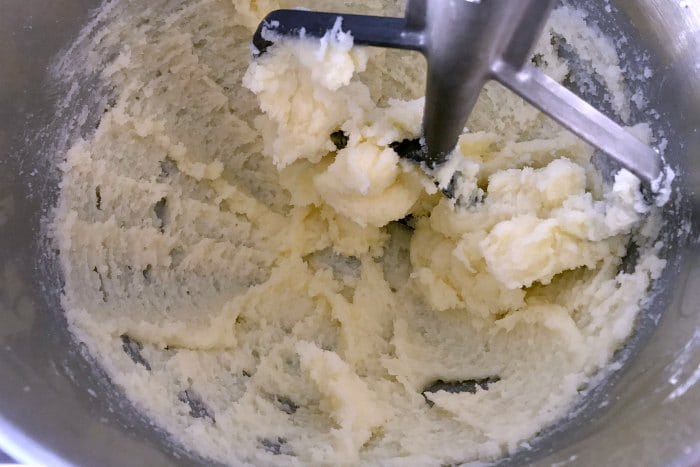 Butter & sugar being creamed together using the creaming method