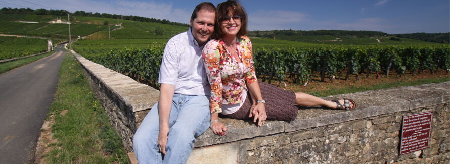 Steve and Gloria alongside vineyard