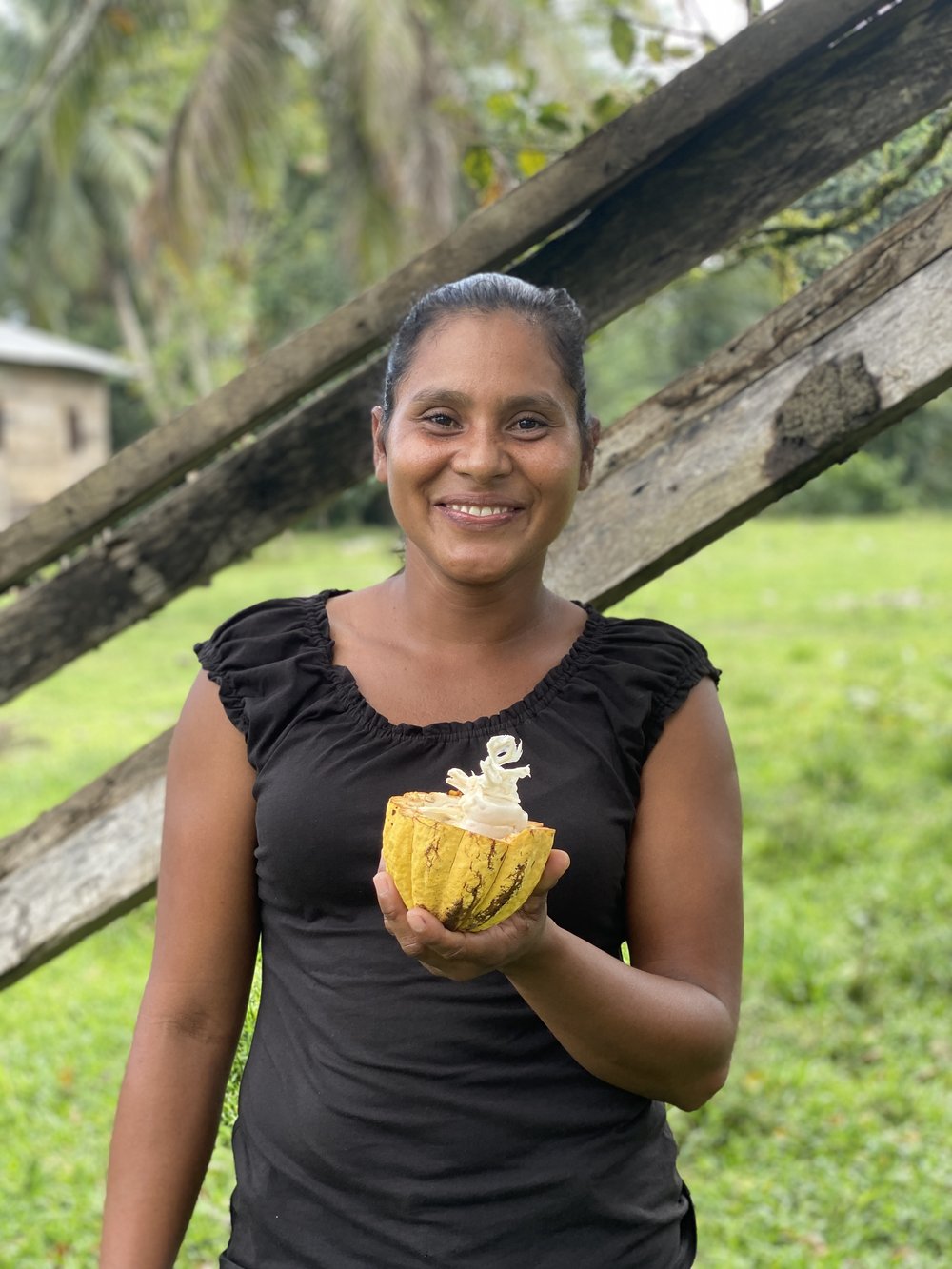 Argentina Cruz López holds cacao pod.jpeg