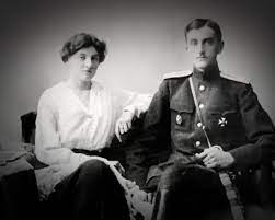 a black and white photo of a couple sitting next to each other