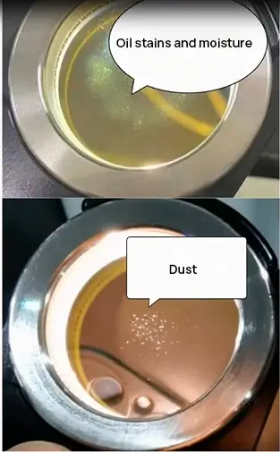 oil dust or moisture appears on the lower protective lens of the laser cutter