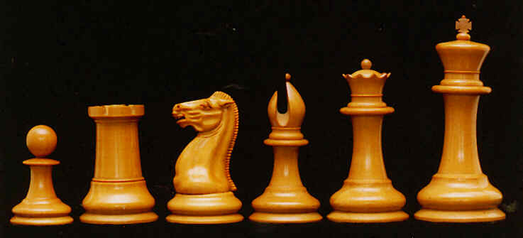 Six 1849 Staunton chess pieces are lined up to show their trademark design