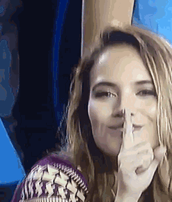 Woman “Shh” Finger to Lips