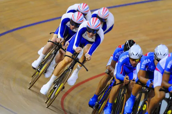 The British team of Ed Clancy, Paul Manning, Geraint Thomas and Bradley Wiggins about to lap the Russians on their way to setting a new world record in the heats of the men's team pursuit. They went on to win gold. Photograph: Tom Jenkins/Guardian