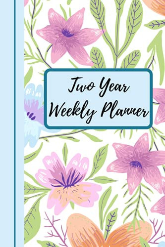 Two Year Weekly Planner: A pretty floral weekly planner for women. The floral theme is carried on inside.