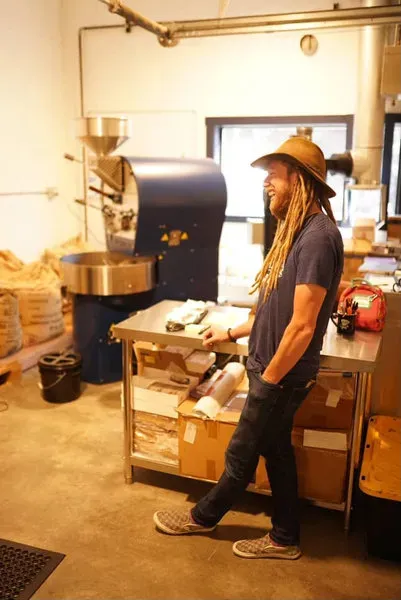 Scott roasting at his coffee shop.