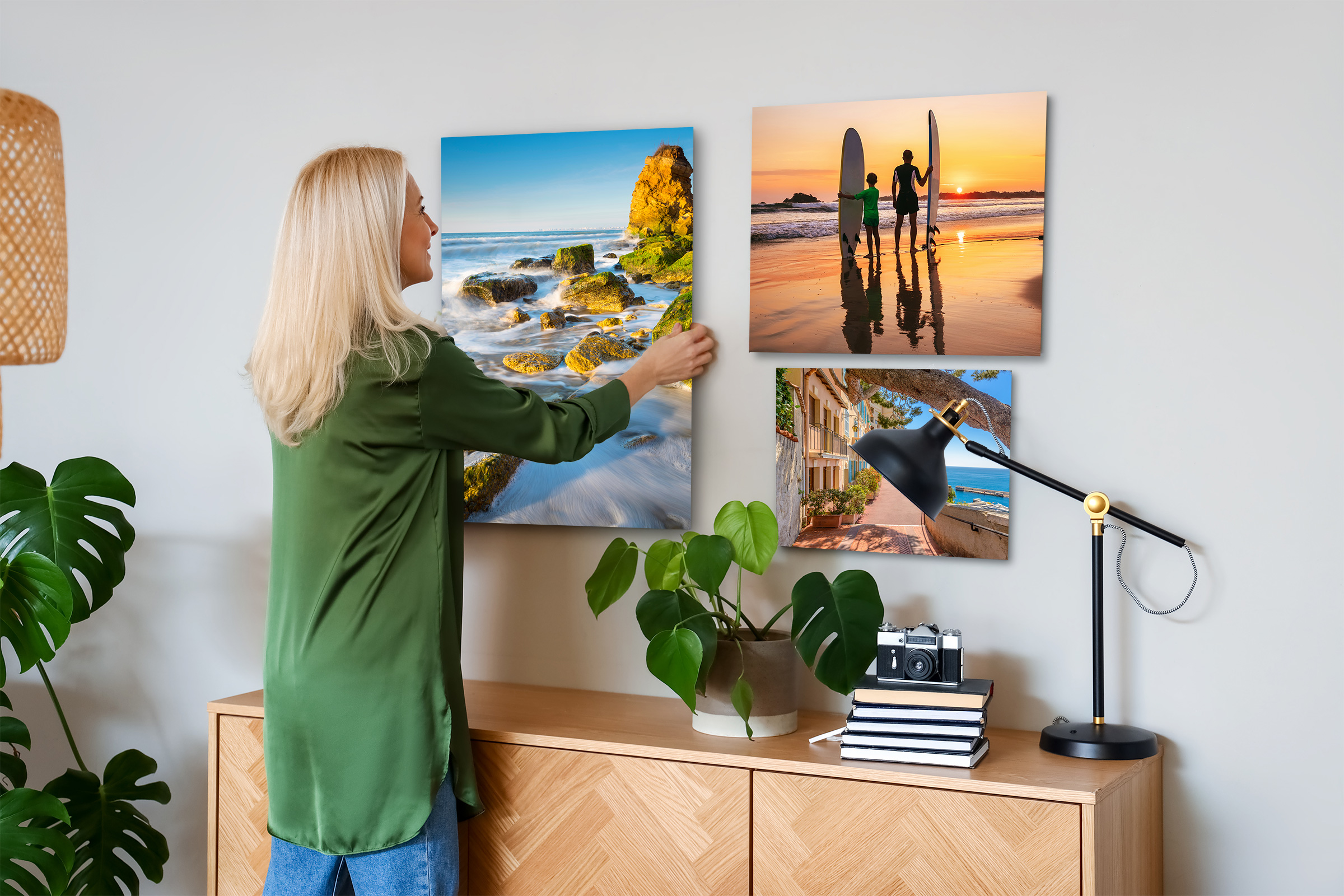 Woman hanging Multiple Ocean and Coastal Landscapes on Metal Prints