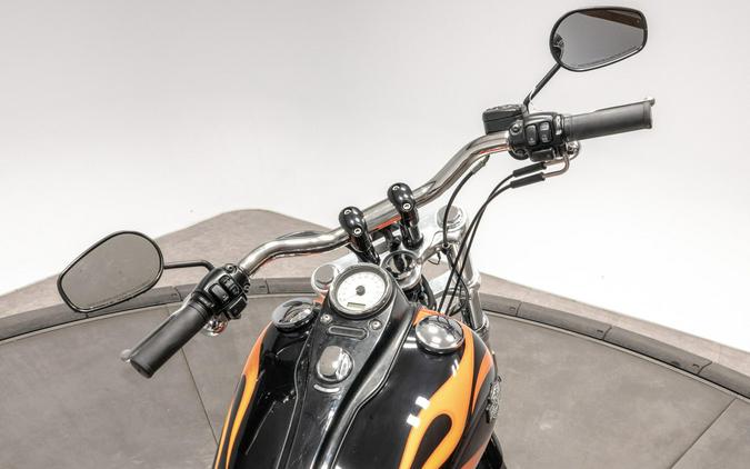 2010 HARLEY-DAVIDSON FXDWG WIDE GLIDE in Black w/ Flames with 16,100 miles