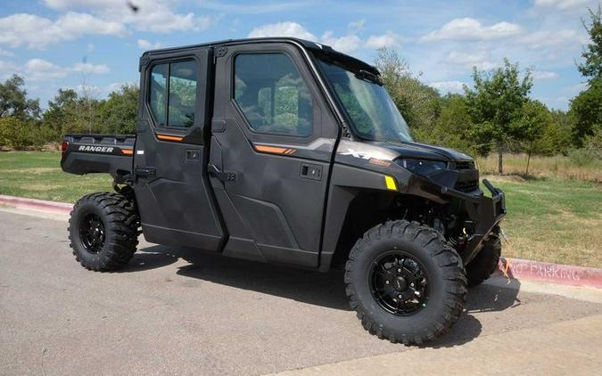 New 2024 POLARIS RANGER CREW XP 1000 NORTHSTAR ULTIMATE SUPER GRAPHITE WITH ORANGE BURST ACCENTS