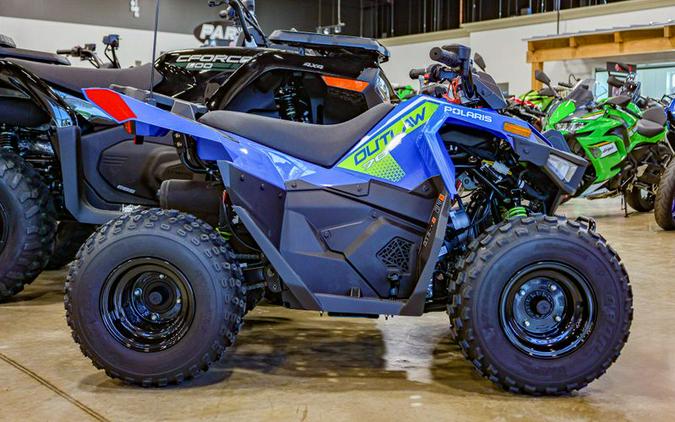 New 2025 POLARIS OUTLAW 70 EFI VELOCITY BLUE LIFTED LIME