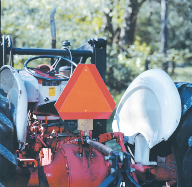 Slow moving vehicle sign