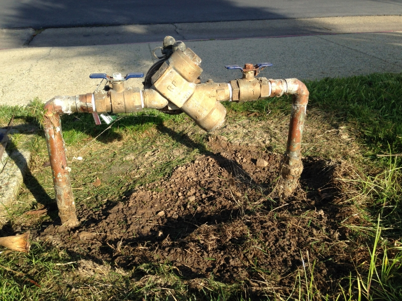Image of a backflow prevention assembly at a single family residence.