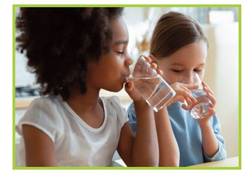 image of two children drinking water from glasses.