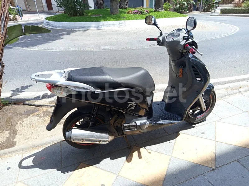 Honda Pasión 125 - Vista 3