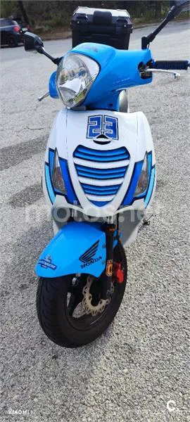 Honda NES 125 – Vista 4
