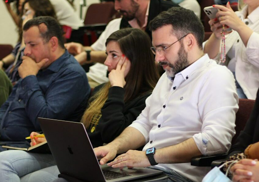 A group of people watching a presentation at Digital Interaction #2022.