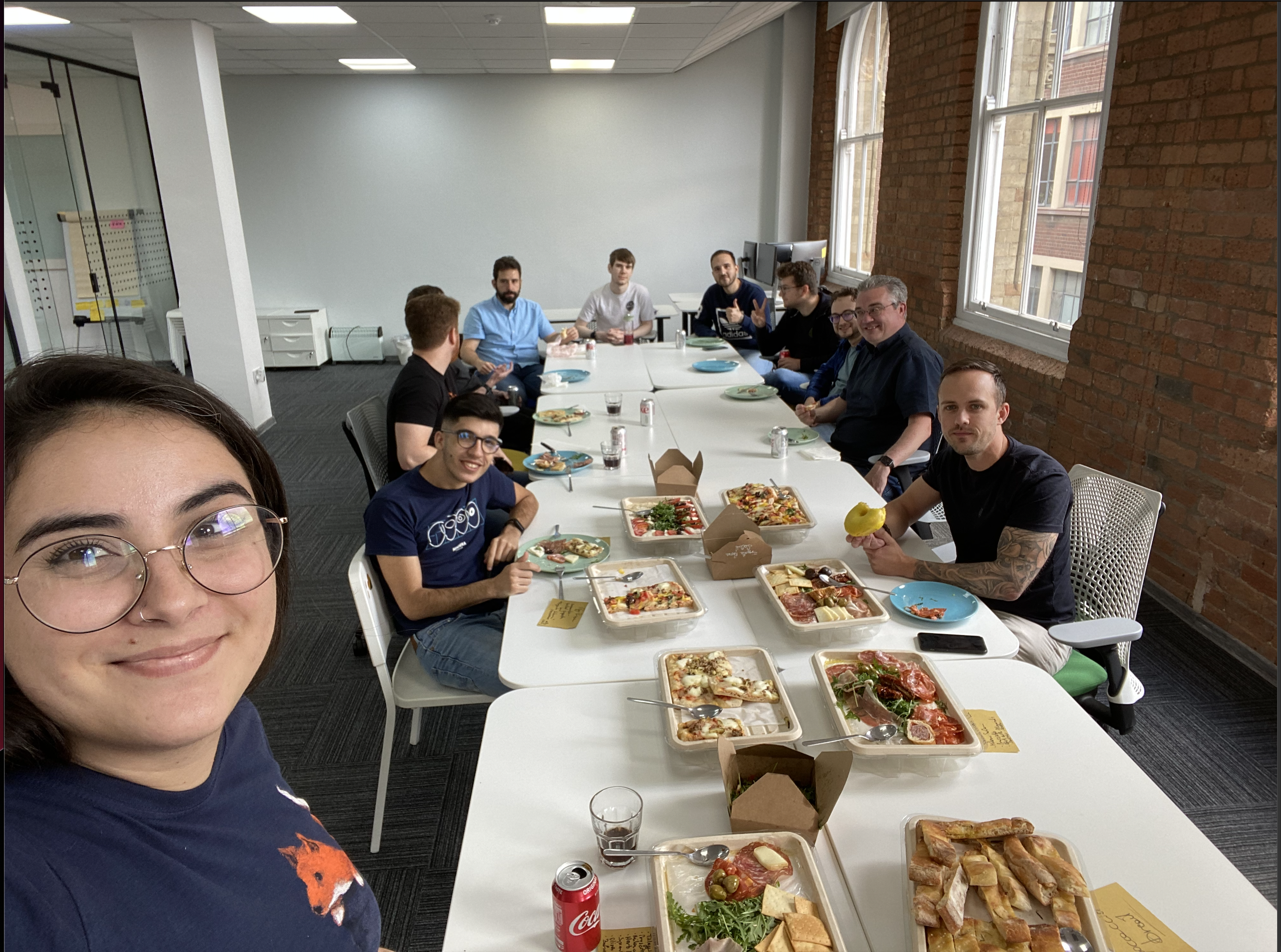 12 UK Minders are enjoying a feast in the Mindera UK office.