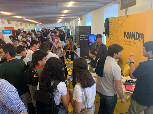 A big crowd of people by the Mindera stand at JNation in June 2022.