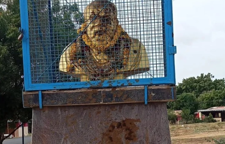 Throwing cow dung on the statue of Periyar