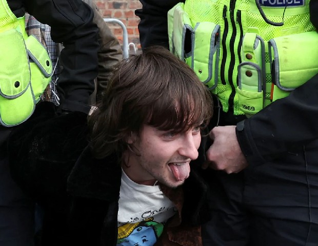 young Protester throw eggs on King Charles III