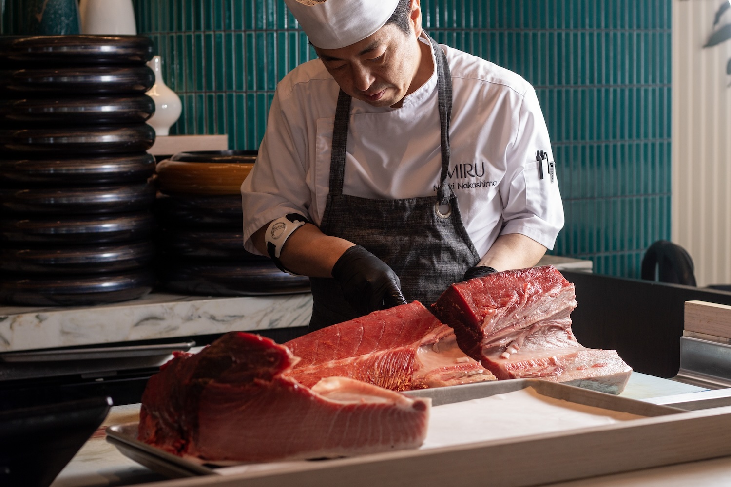 Chef Naoki butchers a whole tuna for the Tuna Experience at Miru.