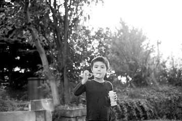 Boy bubbles white tree photography