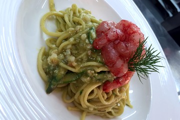 Homemade tagliolini with fresh asparagus and red prawns at sale e pepe