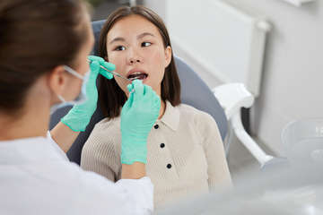 Asian girl in dental chair yjx647l  1 