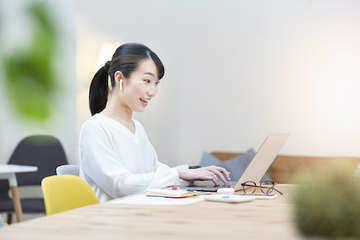 Asian young woman talking computer screen